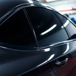 Discover the best window tint Chattanooga TN, featuring a professionally tinted vehicle in a vibrant garage.